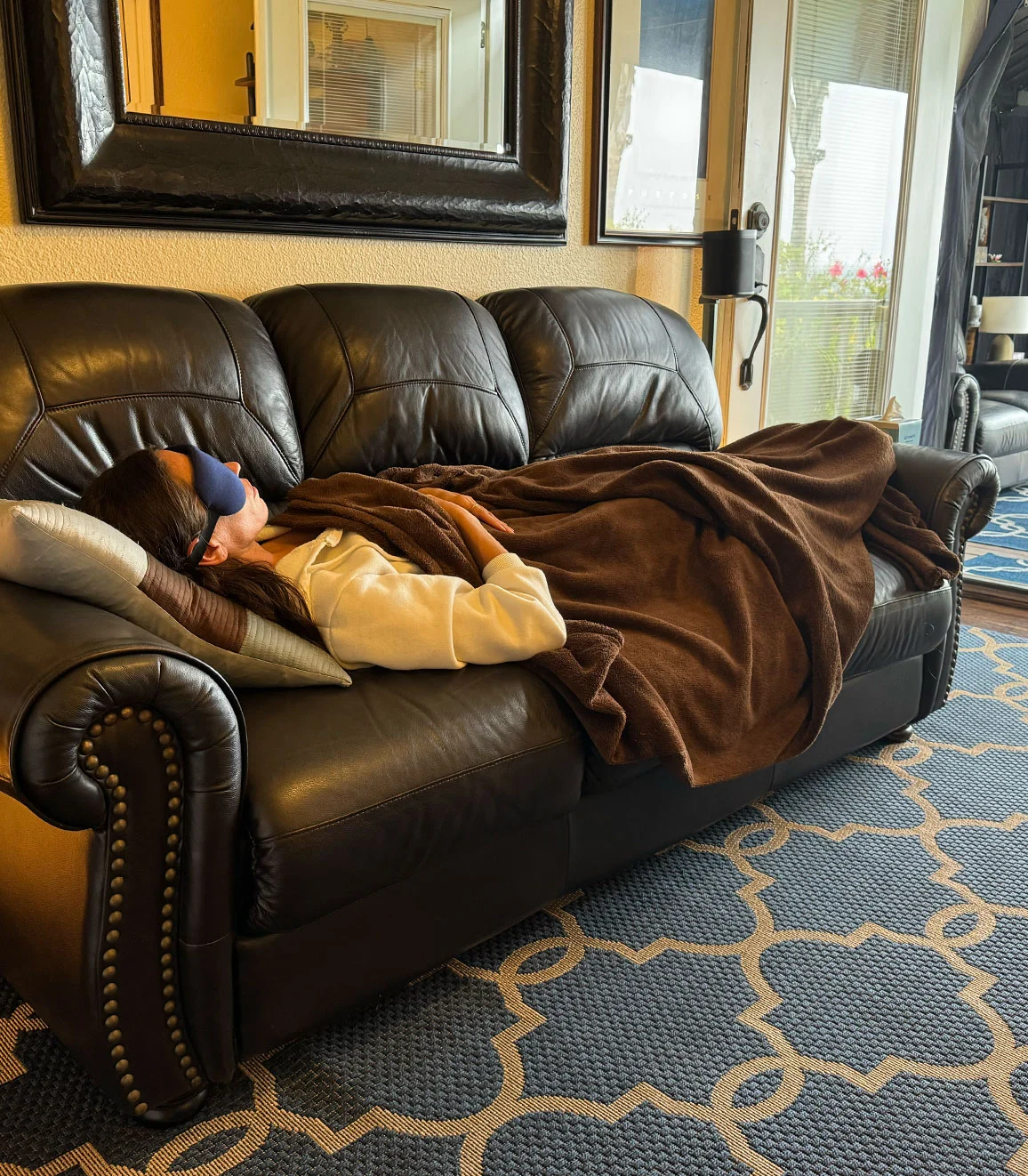 A person resting comfortably under a blanket during integration